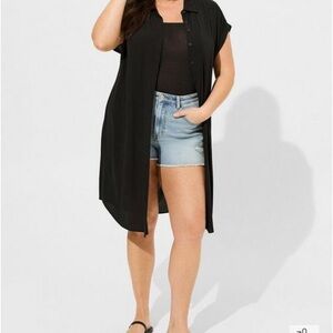 Long button up jacket by Torrid can be worn as a dress.